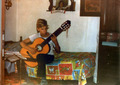 Thanos at his first year of guitar study while practicing at home (Naousa - 1981-82)